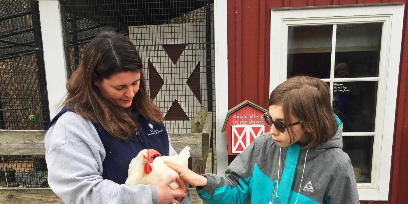 Animal keeper Nikki Maticic holds a chicken during the Meet A Keeper demonstration.