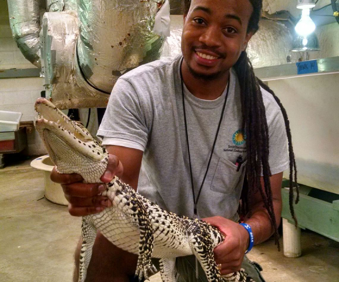 Kyle holds 4-year-old Cuban crocodile, Jésus