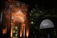 The Zoo will be decked out in the Halloween spirit for Boo at the Zoo. Orange spider web projection on outdoors of Reptile Discovery Center.