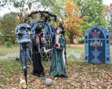 Halloween vignettes and festive decor are a Boo at the Zoo highlight. A spooky Halloween display with skeletons.