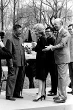 First Lady Patricia Nixon with a group of people at the welcome ceremony for giant pandas Ling-Ling and Hsing-Hsing