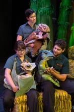 “Erth’s Dinosaur Zoo Live” takes audiences on a prehistoric journey into a new dimension where they get to meet a menagerie of insects and dinosaurs that roamed the planet millions of years ago. Featuring larger-than-life dinosaur puppets brought to life by sophisticated design and theatrical presentation and puppet mastery, these amazingly life-like dinosaur recreations connect children to paleontology. Photo: C. Waits Three "Erth's Dinos Zoo Live" cast members hold small, winged dinosaur puppets on stage
