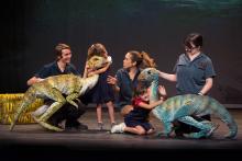 “Erth’s Dinosaur Zoo Live” takes audiences on a prehistoric journey into a new dimension where they get to meet a menagerie of insects and dinosaurs that roamed the planet millions of years ago. Featuring larger-than-life dinosaur puppets brought to life by sophisticated design and theatrical presentation and puppet mastery, these amazingly life-like dinosaur recreations connect children to paleontology. Photo: C. Waits During a production of "Erth's dinos zoo live" cast members and two children interact with two dinosaur puppets